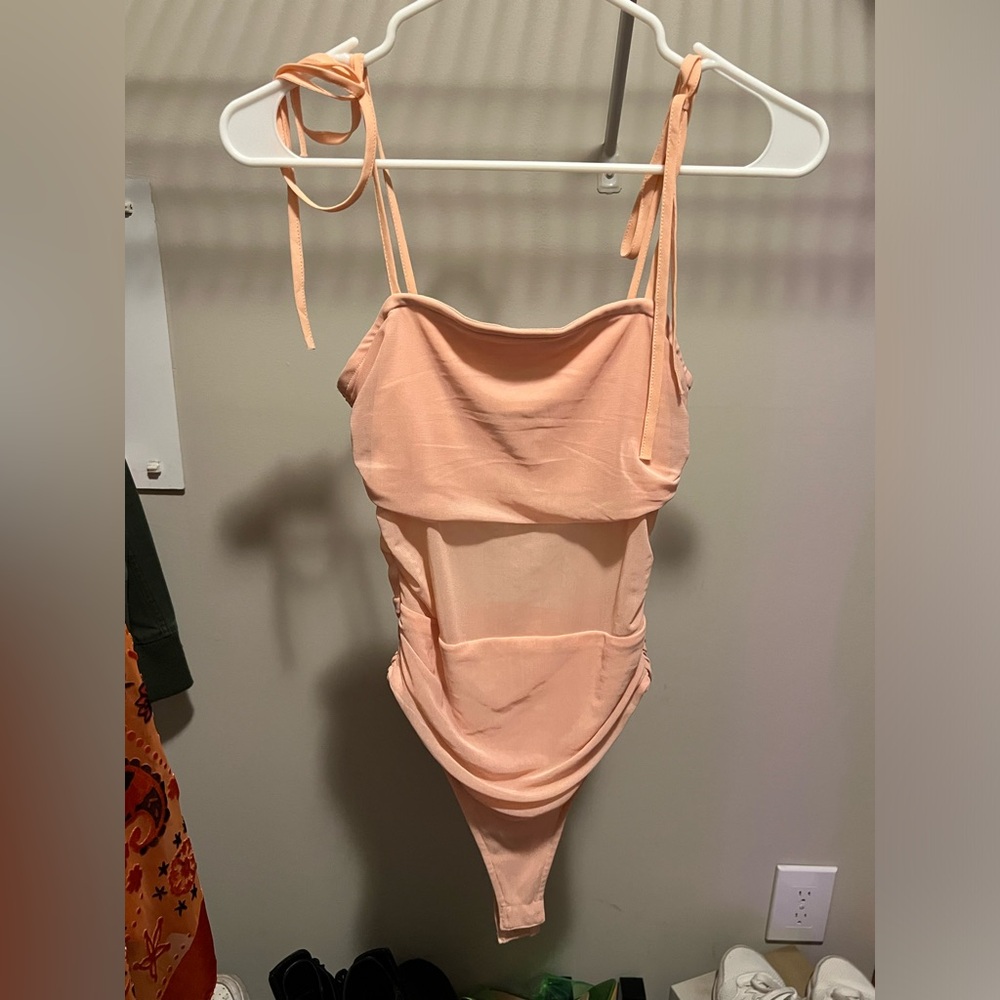 Light pink, part mesh bodysuit.